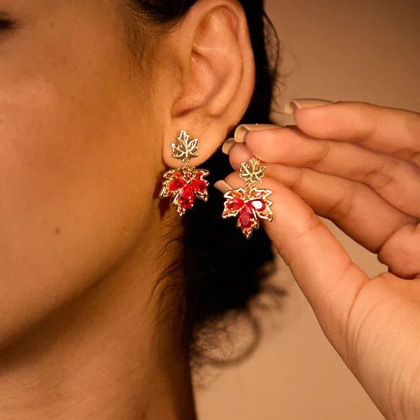 Gold-plated leaf-shaped earrings with red crystals, statement jewelry for women