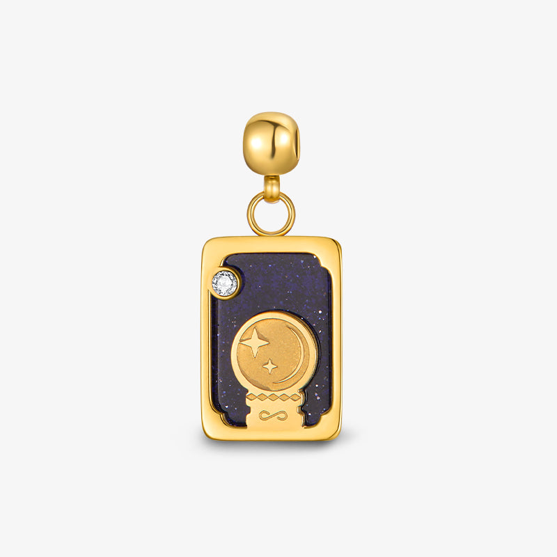 Gold-plated rectangular pendant charm with moon and star design on dark navy enamel background