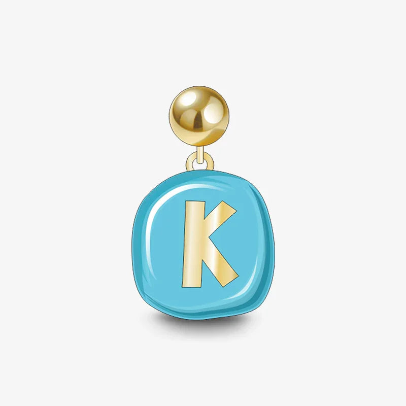 Gold-plated earring with blue enamel charm featuring gold letter K, minimalist jewelry