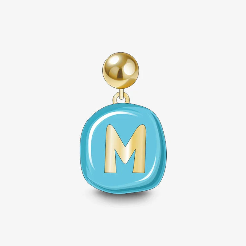 Gold-plated earring with blue enamel charm featuring letter M on white background