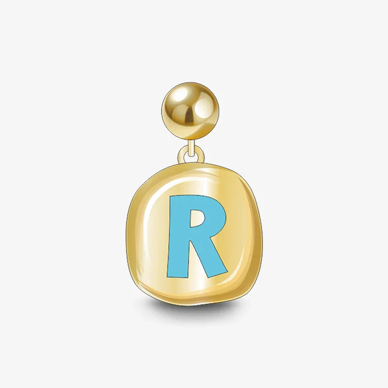 Gold-plated earring with blue letter R charm on white background