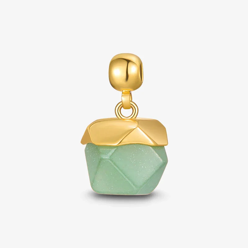Gold-plated pendant with green geometric gemstone on white background