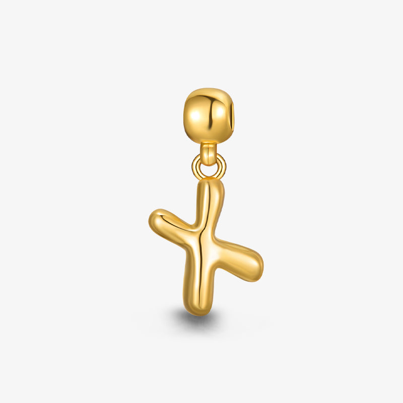 Gold-plated abstract cross pendant charm with smooth finish on white background