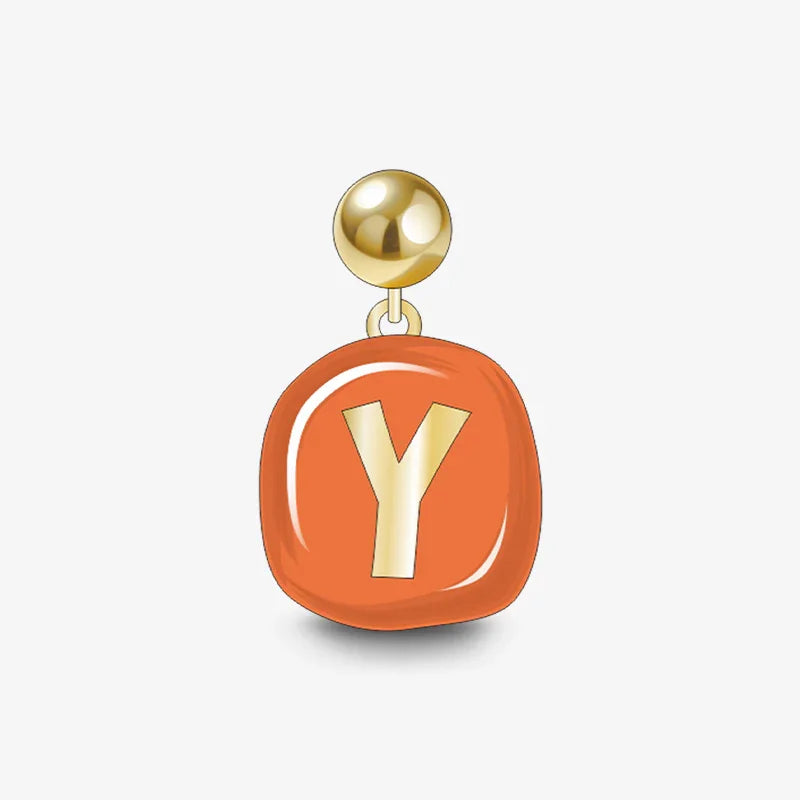 Gold-plated earring with orange enamel charm and letter Y, statement jewelry