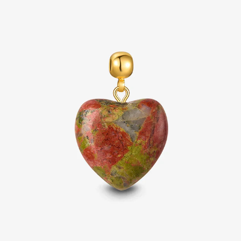 Heart-shaped stone pendant with red, green, and gold tones on a gold-plated bail