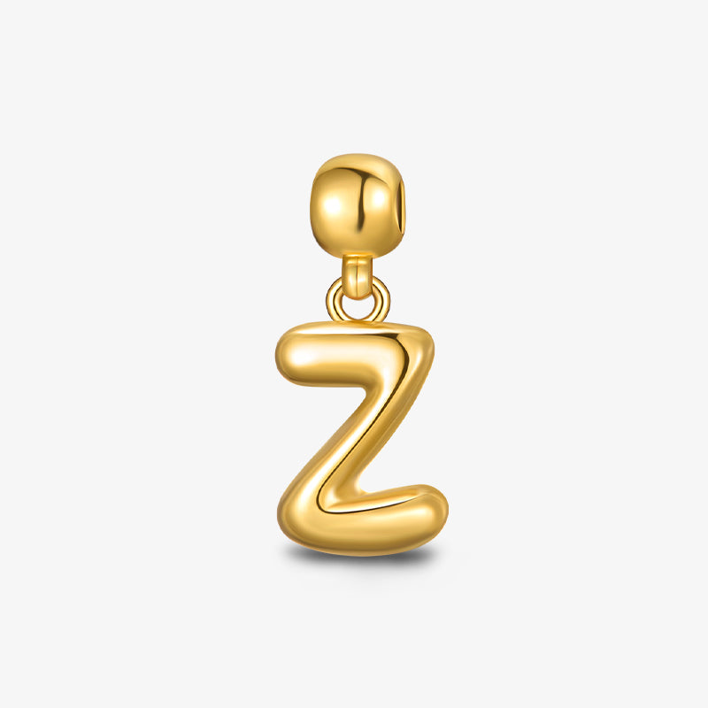 Gold-plated letter Z pendant charm, minimalist jewelry on white background