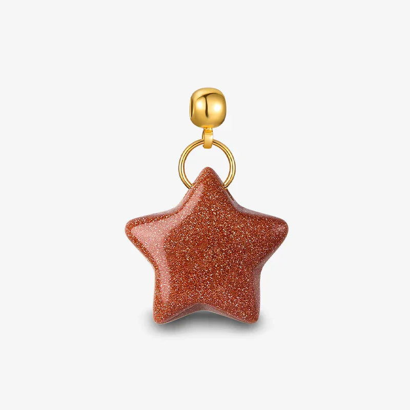 Gold-plated star pendant with brown glitter, minimalist jewelry on white background