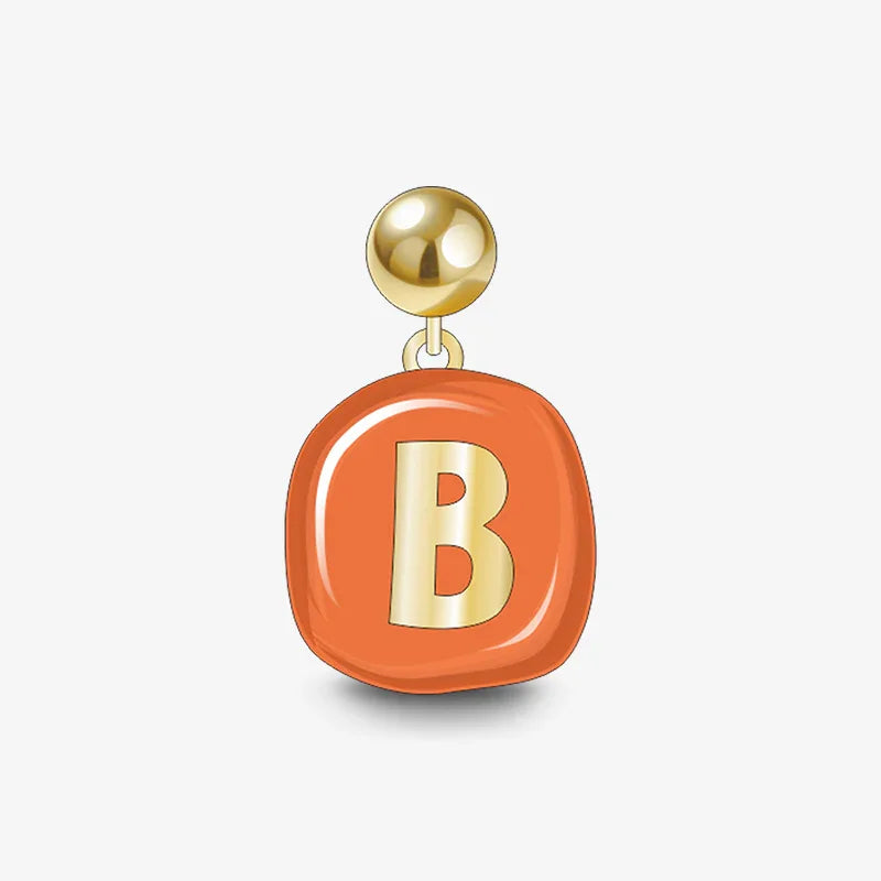 Gold-plated stud earring with orange pendant and metallic letter B charm