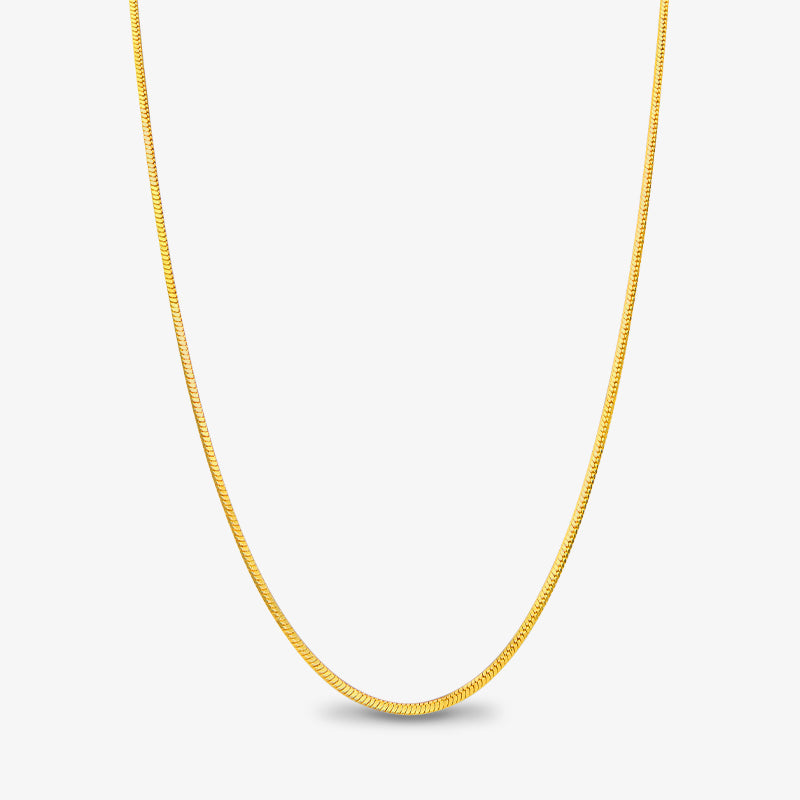 Gold-plated herringbone chain necklace on white background, minimalist jewelry style