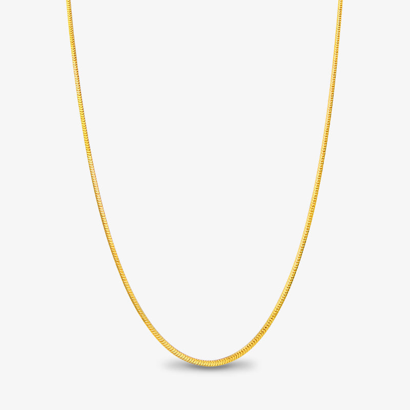 Simple gold-plated chain necklace on white background, elegant minimalist jewelry
