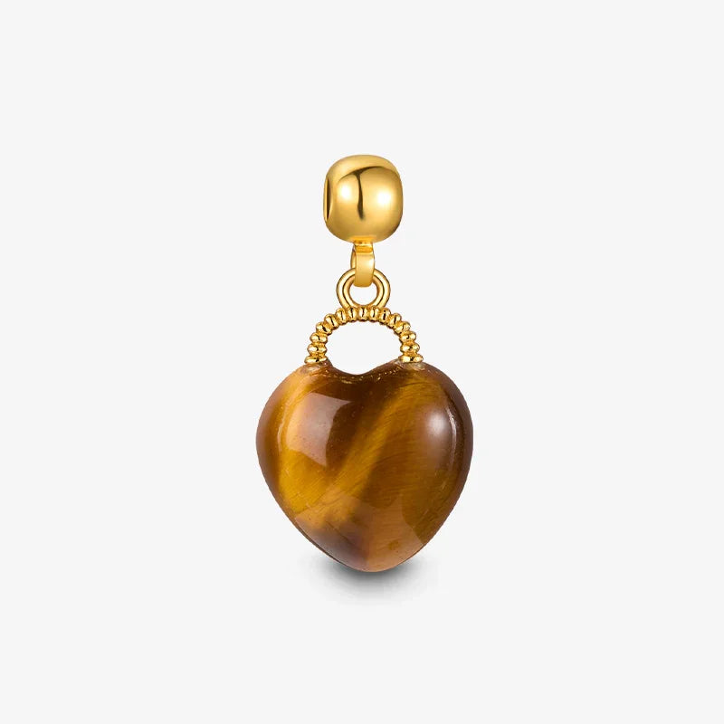 Gold-plated heart-shaped pendant with brown gemstone on white background