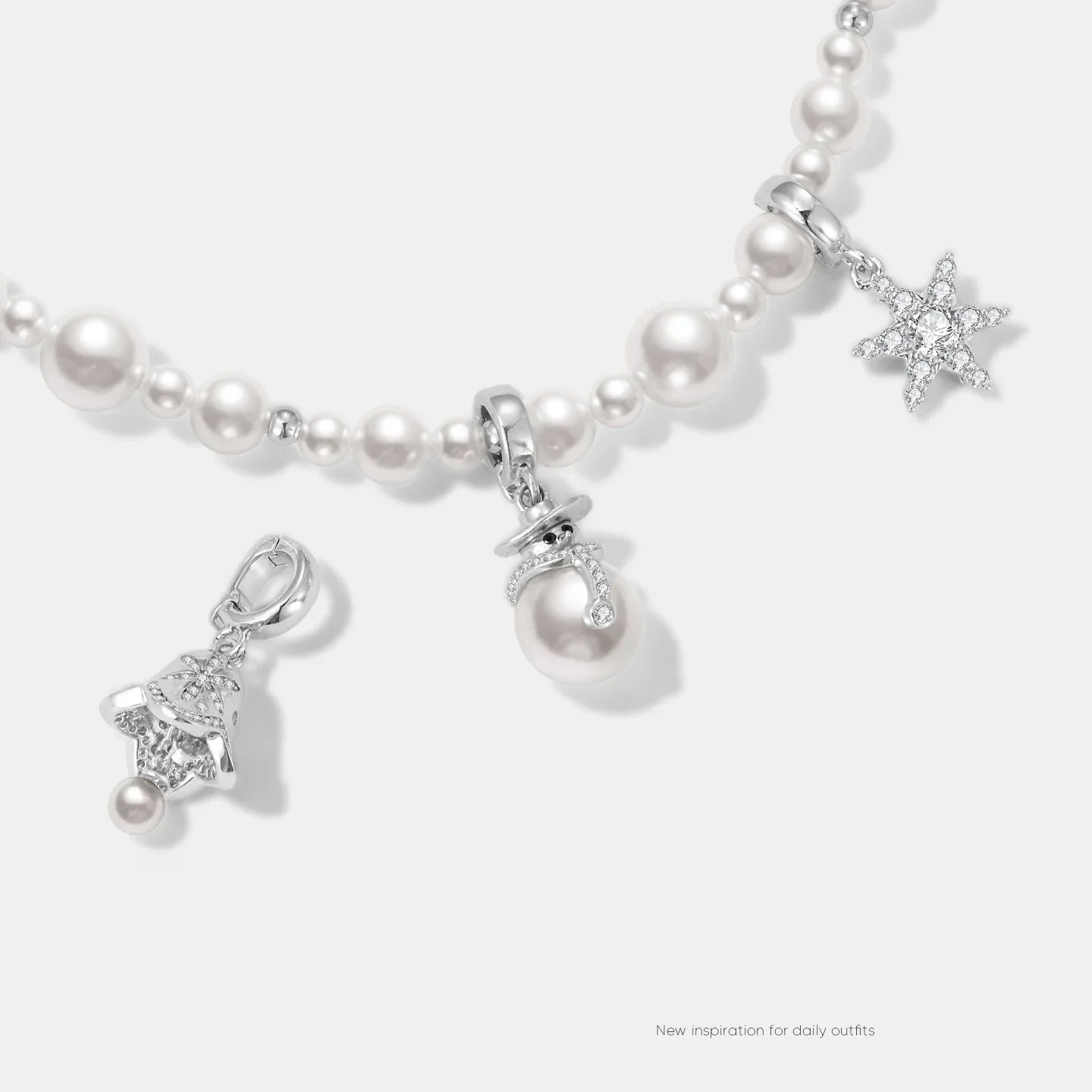 Pearl beaded necklace with silver star and bell charms, elegant statement jewelry