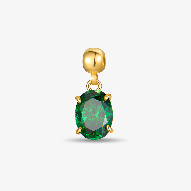 Gold-plated pendant with oval green gemstone against white background