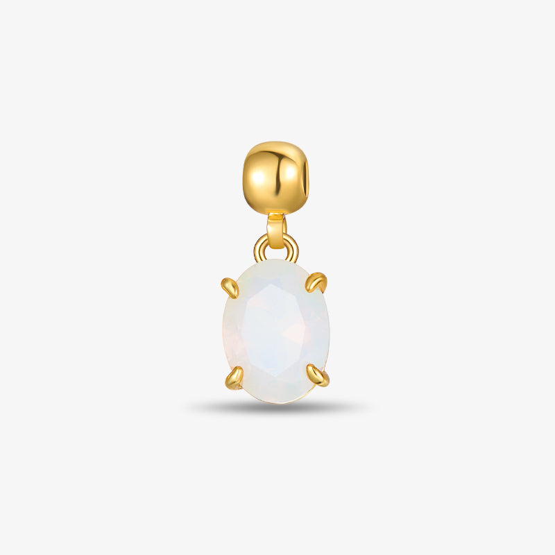 Gold-plated charm with oval white opal gemstone on a light background