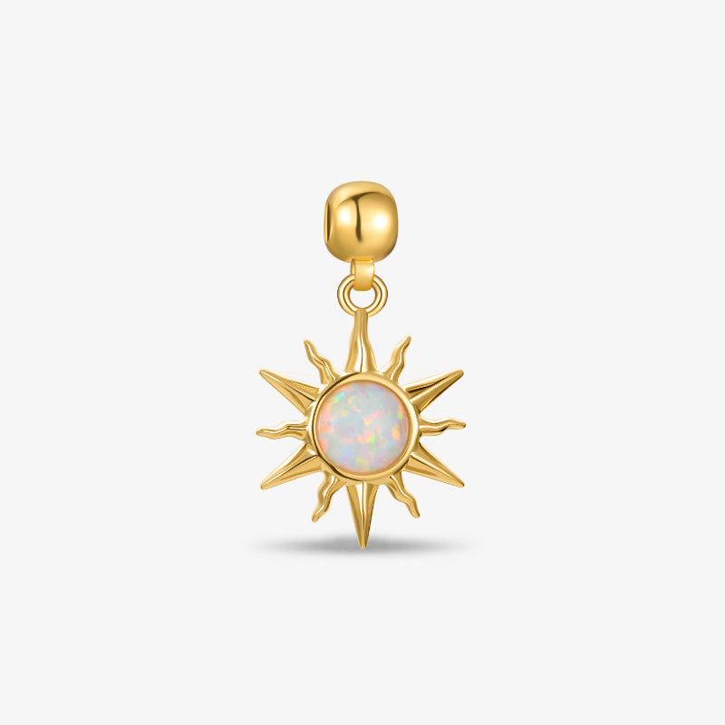 Gold-plated sunburst pendant with iridescent opal center on white background