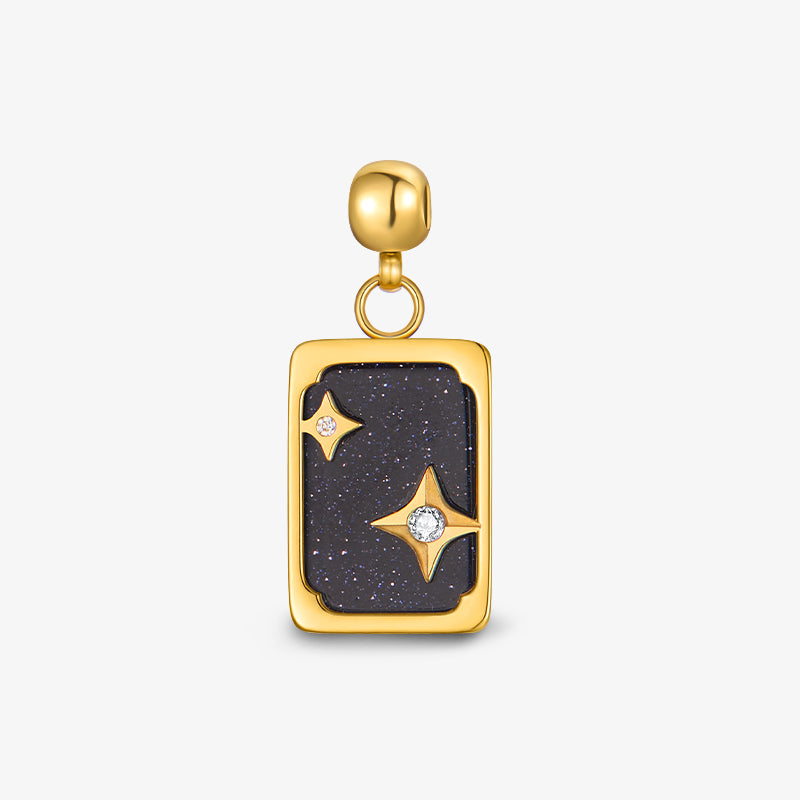 Gold-plated rectangular pendant with dark blue stone and star-shaped accents