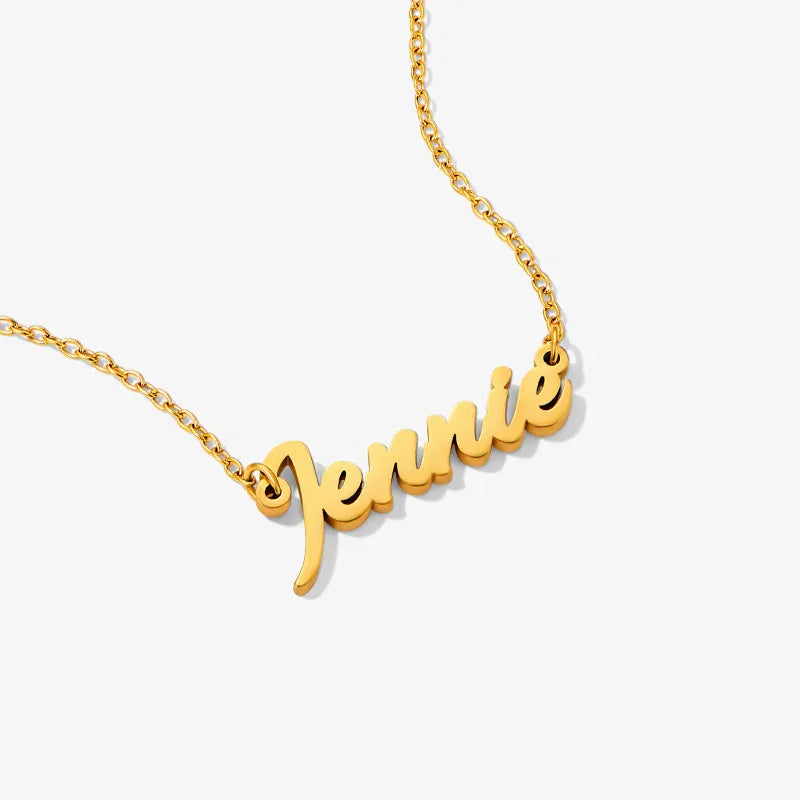 Gold-plated name necklace with 'Jennie' script on a delicate chain, minimalist jewelry