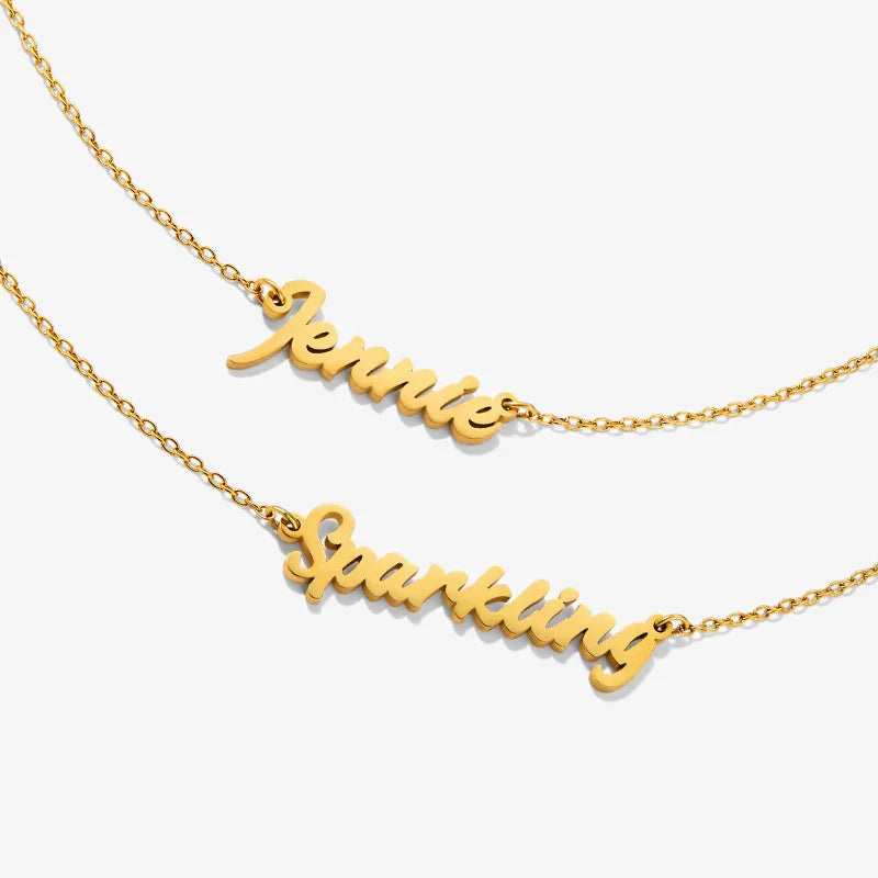 Gold-plated name necklaces with Jennie and Sparkling script on fine chains