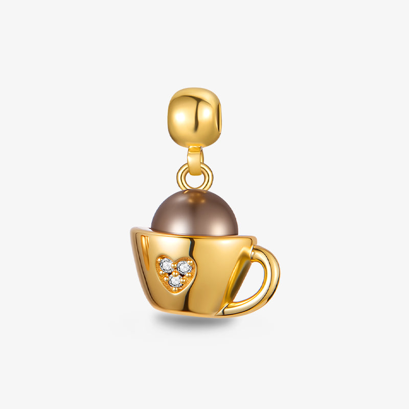 Gold-plated coffee cup charm with pearl detail and heart-shaped rhinestone accent