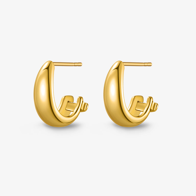 Gold-plated chunky hoop earrings on white background, modern minimalist jewelry
