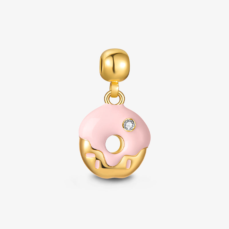 Gold-plated donut charm pendant with pink enamel frosting and a crystal accent