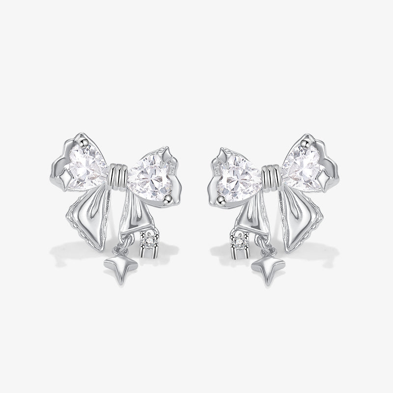 Silver bow-shaped stud earrings with crystal accents on white background