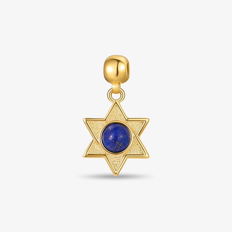 Gold-plated star pendant charm with blue gemstone center on white background
