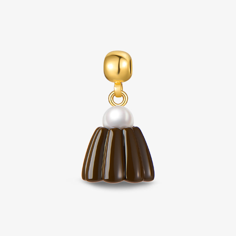 Gold-plated dangle earring with pearl accent and brown enamel design on white background