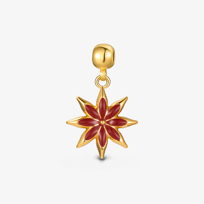 Gold-plated flower pendant with red enamel petals on white background