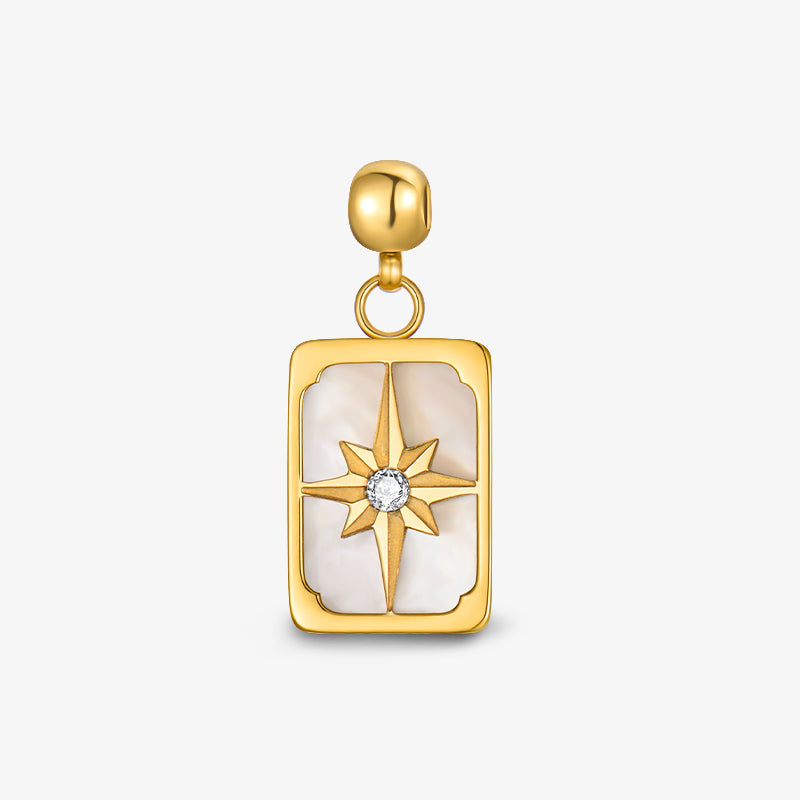 Gold-plated rectangular pendant with compass star and crystal on white background