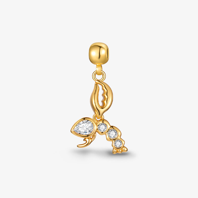 Gold-plated lobster charm pendant with clear crystal accents on white background