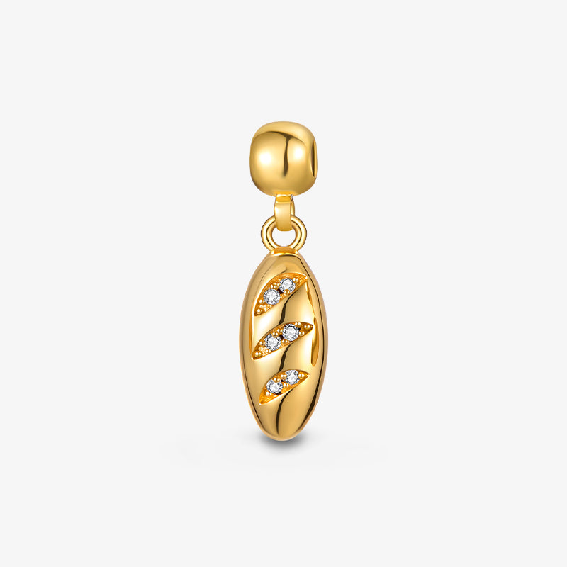 Gold-plated pendant charm with crystal accents on oval design, elegant jewelry accessory
