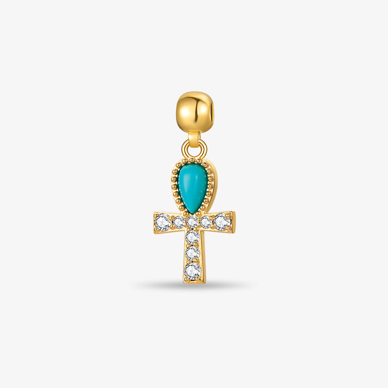 Gold-plated ankh pendant with turquoise stone and clear crystal accents on white background