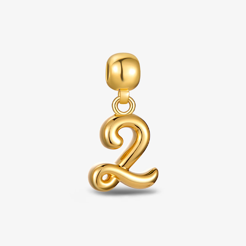 Gold-plated number 2 pendant charm with polished finish on white background