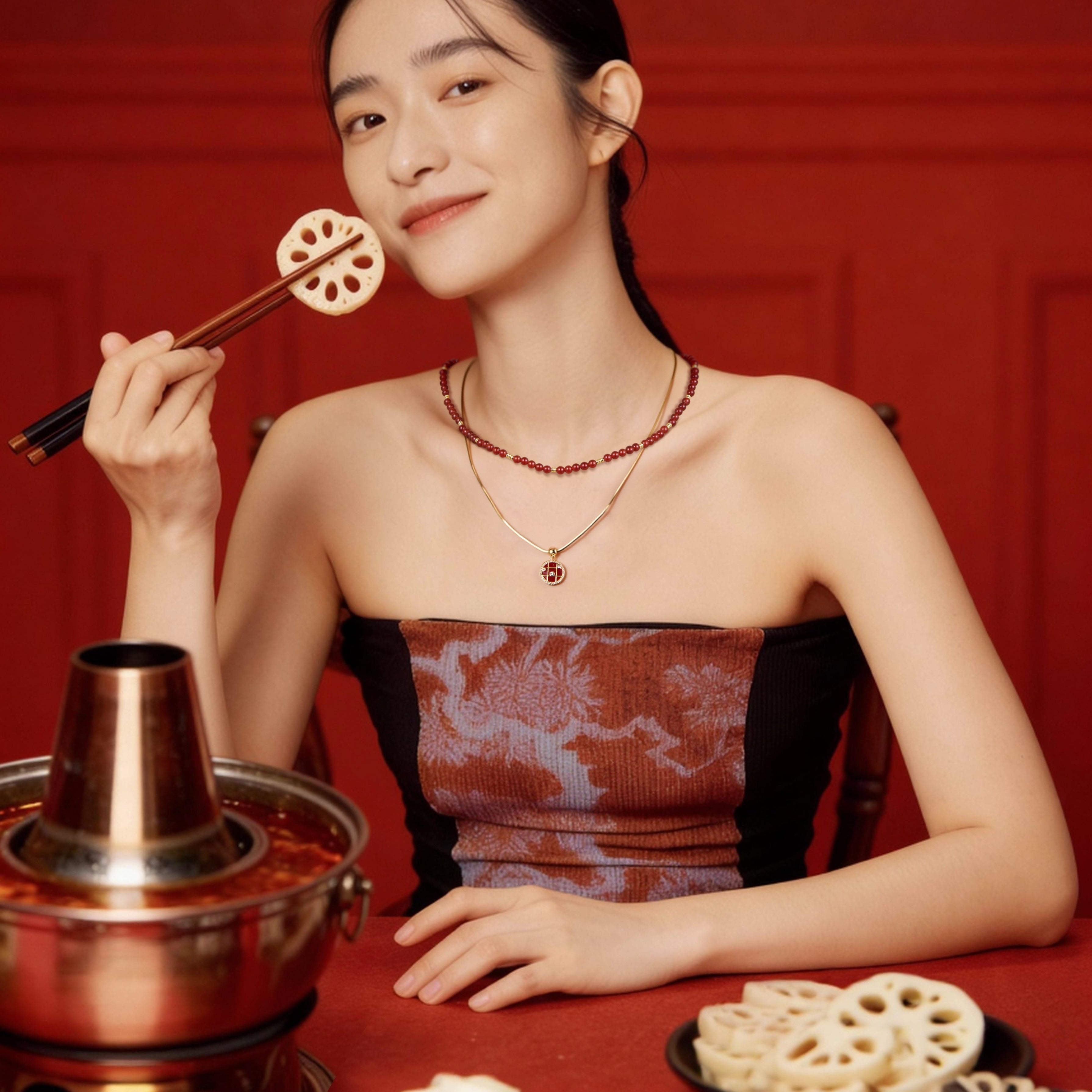 Woman in red strapless dress wearing layered gold necklaces, eating lotus root with chopsticks
