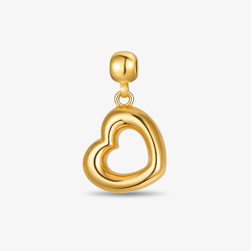 Gold-plated heart-shaped pendant charm on white background